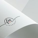 Minimalist design showcasing Favour Media logo on folded textured paper with copyspace.